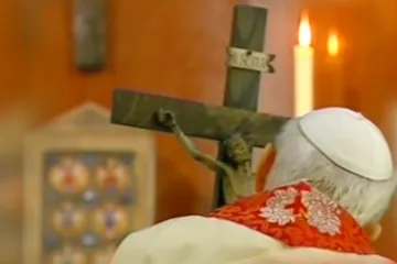 Pope John Paul II holds a crucifix carved by Stanisław Trafalski on Good Friday 2005